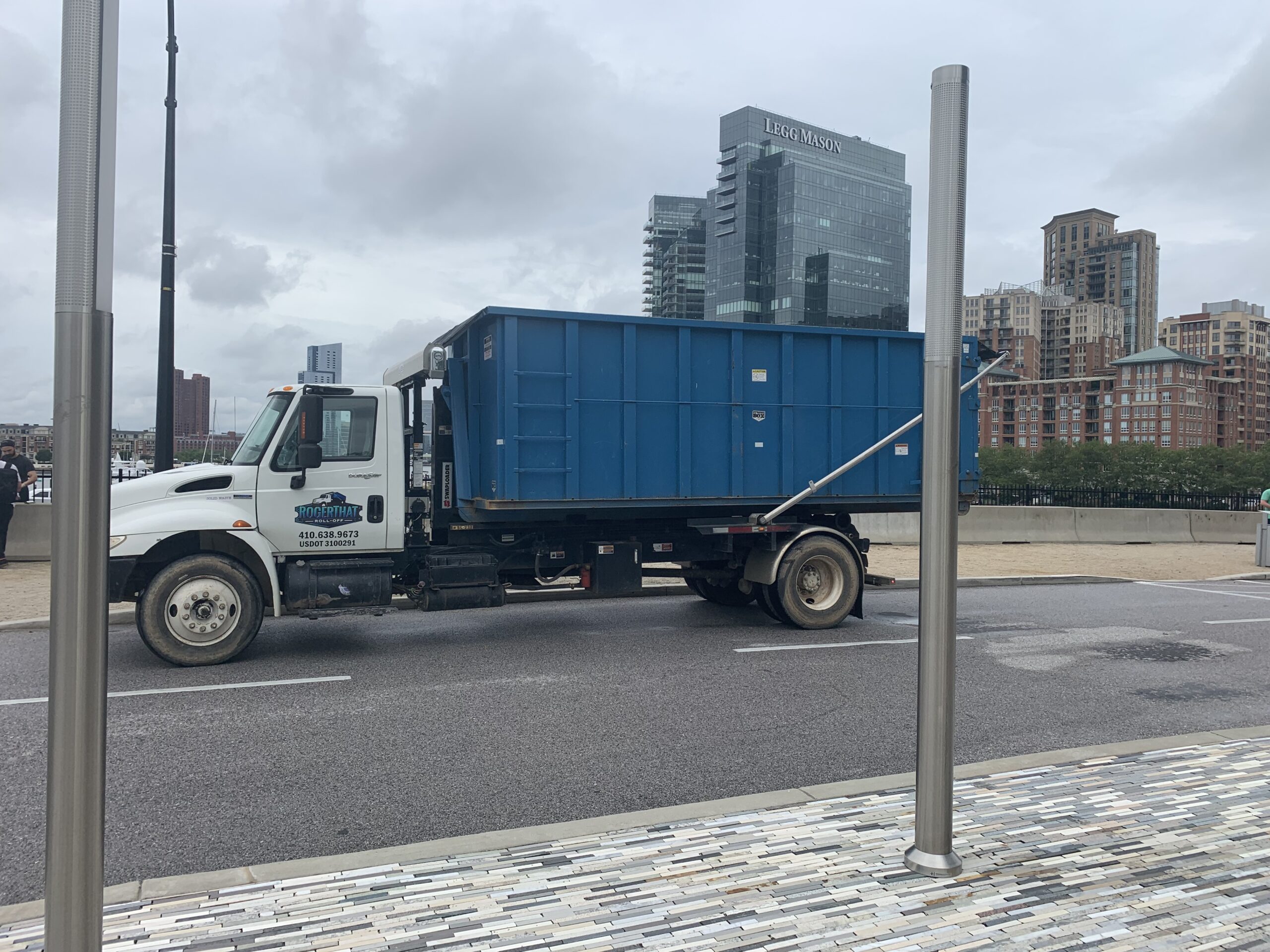 Dumpster being driven to the rental site