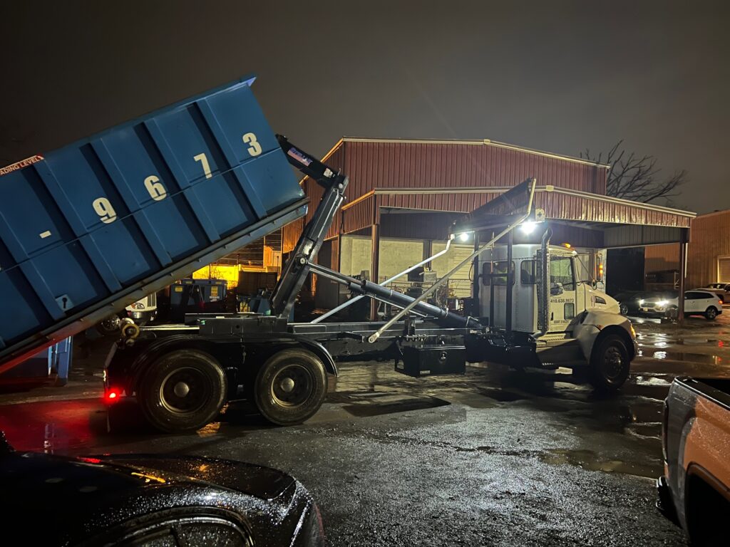Dumpster being offloaded